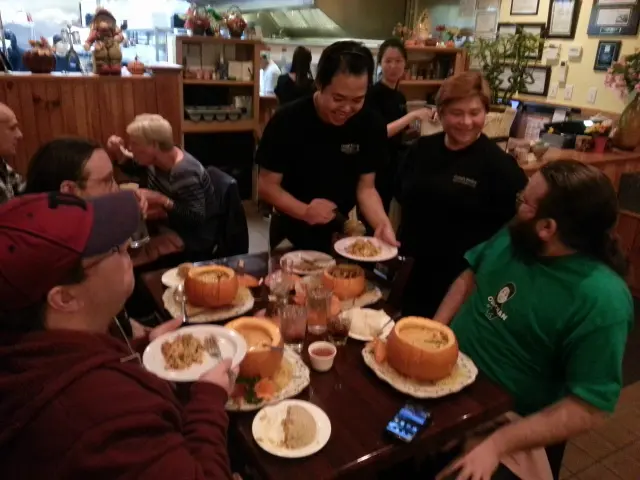 Guests sharing dishes at a table