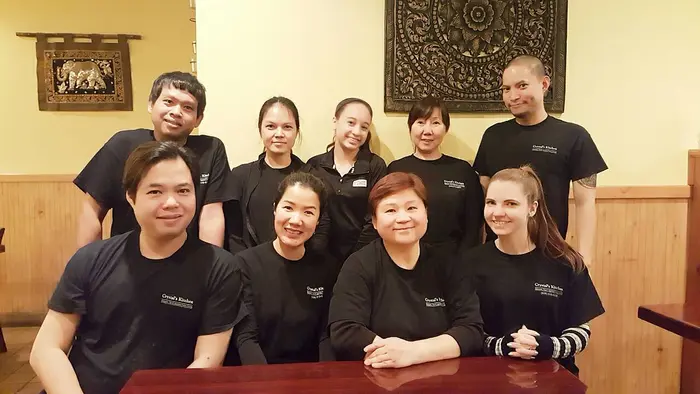 The Crystal’s Kitchen team gathered around a table